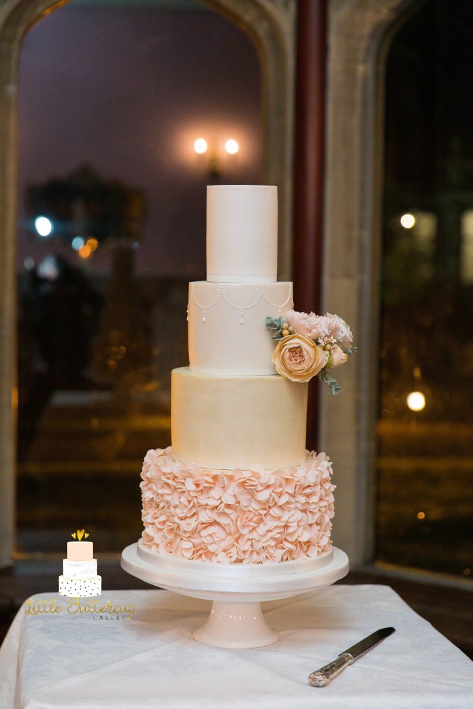 Blush peach ruffle and light gold wedding cake