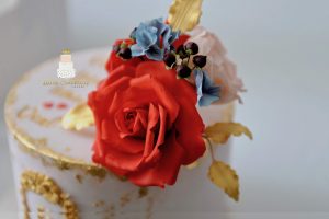 Blush gold and red birthday cake