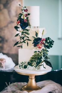 Tropical wedding cake adorned with sugar flowers